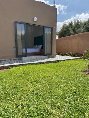 a bedroom in a house with a bed in it at Villa JADE with private pool only family in Marrakech