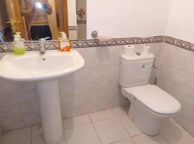 a bathroom with a white toilet and a sink at Modern 2 Bedroom Appartement in Gueliz in Marrakech