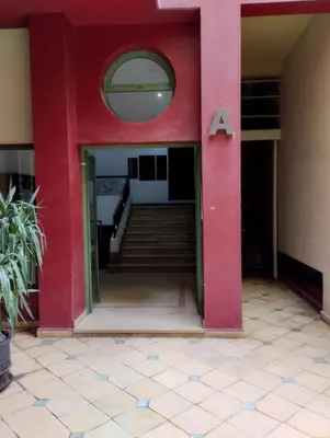 an entrance to a red building with a letter at Modern 2 Bedroom Appartement in Gueliz in Marrakech