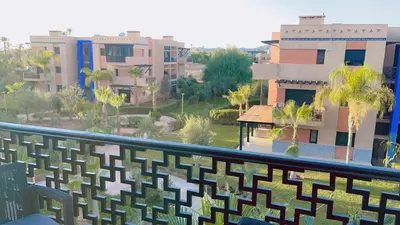 a view of a city from a balcony at Ben House Palmeraie in Marrakech