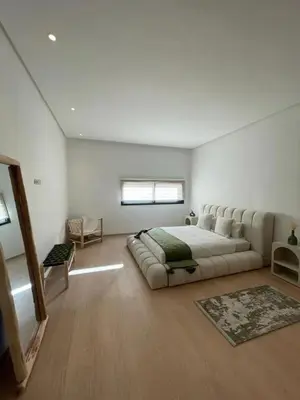 a bedroom with a large bed and a couch at Villa spacieuse à Marrakech avec piscine privée_222 in Marrakech