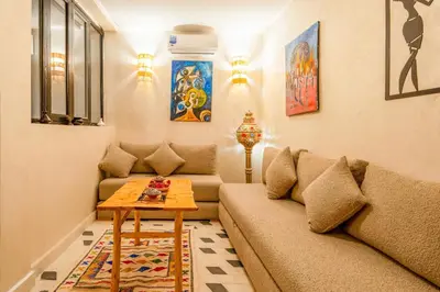 a living room with a couch and a table at Dar mehdi in Marrakech