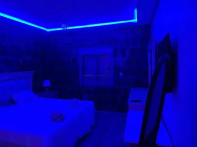 a blue room with a bed and a blue light at villa ourika in Marrakech