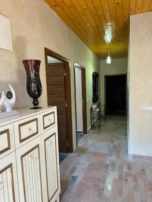 a living room with a vase on top of a counter at villa ourika in Marrakech