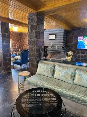 a living room with a couch and a table at villa ourika in Marrakech
