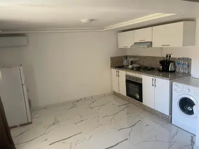 a kitchen with a washer and dryer in a room at Appartement downtown marrakech in Marrakech