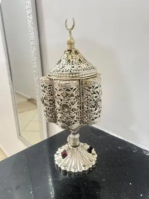 a silver lamp sitting on top of a table at Elegant appartement a Gueliz in Marrakech