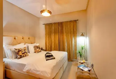 a bedroom with a large white bed and a window at luxury, 4 pools et golf in prestigious in Marrakech