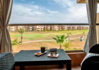 a table with two plates of food on top of a window at luxury, 4 pools et golf in prestigious in Marrakech