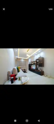 a large living room with a couch and a table at Magnifique appartement avec piscine à Gueliz in Marrakech