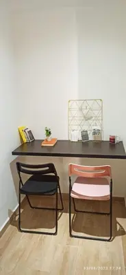 a black desk with two chairs in front of it at Magnifique appartement avec piscine à Gueliz in Marrakech