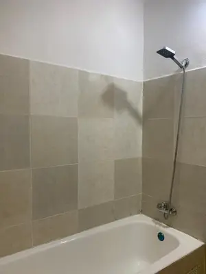 a bathroom with a bath tub with a shower at Cosy gem in the heart of marrakech in Marrakech