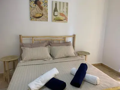 a bedroom with a bed with two towels on it at Cosy gem in the heart of marrakech in Marrakech