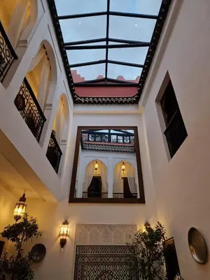 a room with a ceiling with a window at Riad Rose Jade Marrakech in Marrakech