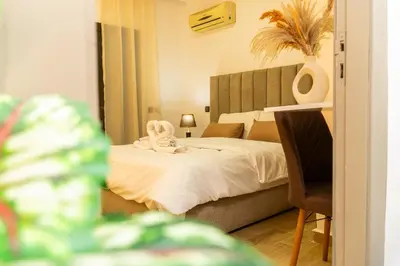 a bedroom with a bed with a towel on it at Appartement Moderne à Marrakech in Marrakech