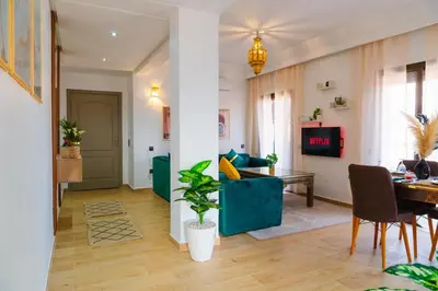 a living room with a couch and a table at Appartement Moderne à Marrakech in Marrakech