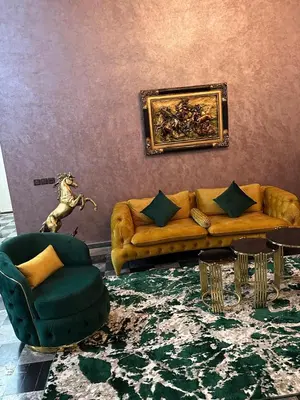 a living room with a couch and a table at Villa haut standig 2000 m2 in Marrakech