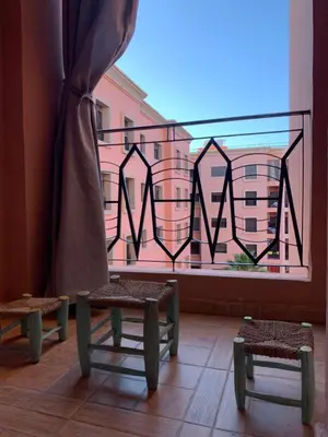 a room with a window with a view of a building at chic&Calm appartment in gueliz in Marrakech