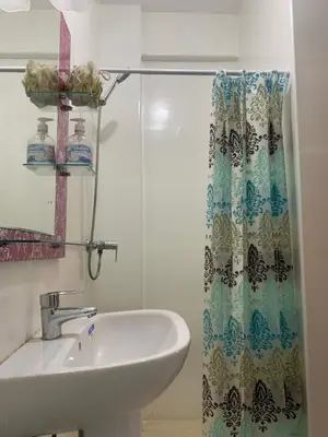a bathroom with a sink and a shower curtain at chic&Calm appartment in gueliz in Marrakech