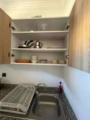 a kitchen counter with a sink in a kitchen at Habiba in Marrakech