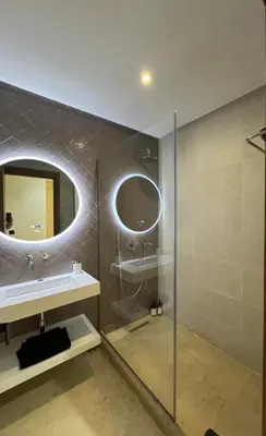 a bathroom with a sink and a mirror at Prestige cocon in Marrakech