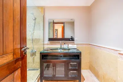 a bathroom with a sink and a shower at Cozy Stay with Garden & Pool, 10min to Center in Marrakech