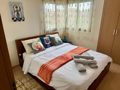 a bedroom with a bed with towels on it at Marrakech 3 ch piscine et déco artisanale parfait business et famille in Marrakech