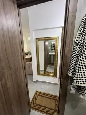 a hallway with a mirror and a room at Modern Apartment in Great Location of Marrakesh in Marrakech