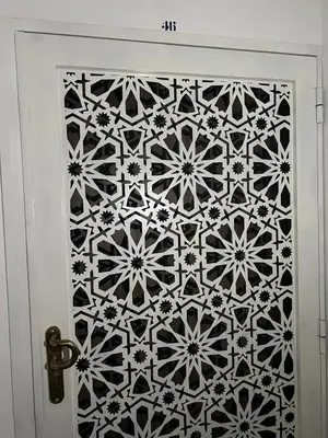 a door with a black and white tile on it at Modern Apartment in Great Location of Marrakesh in Marrakech