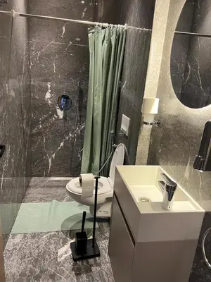 a bathroom with a shower and a toilet and a sink at cozy apartment in Marrakesh in Marrakech