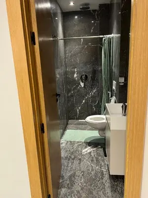 a bathroom with a shower and a toilet and a sink at cozy apartment in Marrakesh in Marrakech