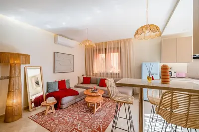 a living room with a couch and a table at Lux & comfort Sunny terrace in Gueliz in Marrakech