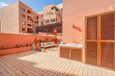 a patio with a tub and a sink in a building at Lux & comfort Sunny terrace in Gueliz in Marrakech