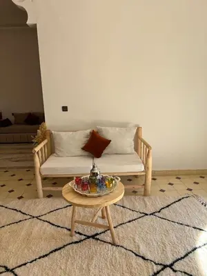 a living room with a couch and a coffee table at Villa Familiale avec Piscine Privée à Marrakech in Marrakech