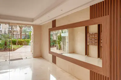 a room with a glass door and a window at pearl garden in Marrakech