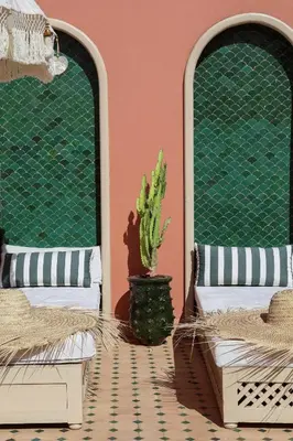 a room with two beds and a cactus at Riad Olma in Marrakech
