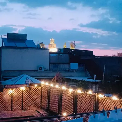a view of a building with lights in front of it at Dar Bellaji l Bed & Breakfast in Medina l Rooftop Koutoubia in Marrakech