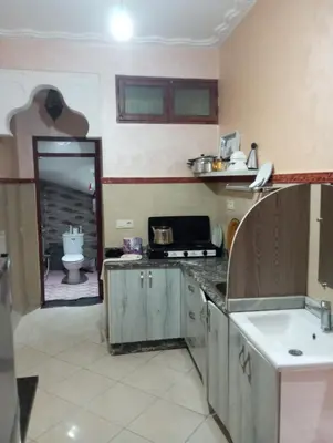 a kitchen with a sink and a toilet in a room at dar immi in Marrakech