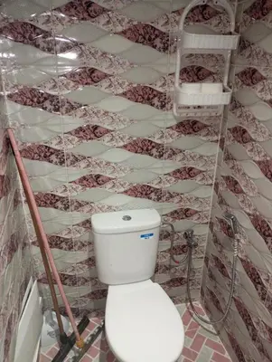 a bathroom with a white toilet in a room at dar immi in Marrakech