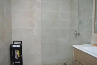 a bathroom with a shower and a sink at Appartement avec piscine in Marrakech