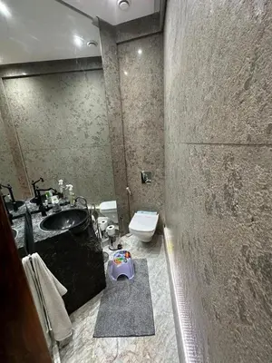 a bathroom with a sink and a toilet at Luxurious villa in Marrakech