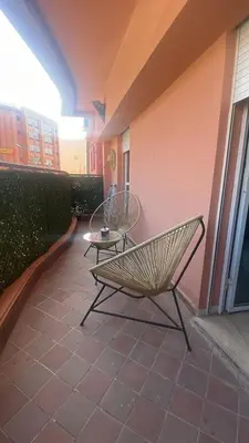 a bench and a table on a patio at Appartement sur Guéliz in Marrakech