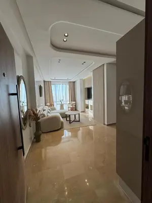 a large living room with a couch and a table at Appartement Siniya Cosy à Marrakech in Marrakech