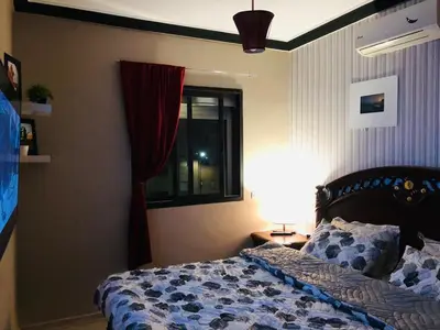 a bedroom with a bed and a window at Apartment Marrakech in Marrakech