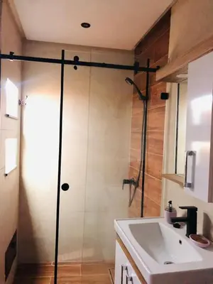 a bathroom with a shower and a white sink at Apartment Marrakech in Marrakech