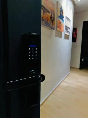 a remote control in a room with a wall at Apartment Marrakech in Marrakech