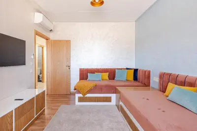 a living room with a couch and a bed at Spacieux 3 chambre au Coeur de Marrakech in Marrakech