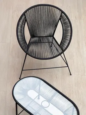 a chair with a glass table in front of it at Maison de Vacances Targa avec Piscine & Terrasse à Marrakech in Marrakech