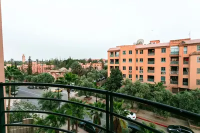 a view of a city from a balcony at Une Galerie Dans Le ciel - Hivernage Marrakech in Marrakech
