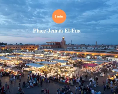 a crowd of people walking around a market at night at Une Galerie Dans Le ciel - Hivernage Marrakech in Marrakech